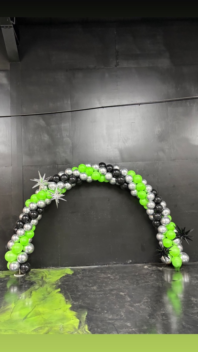 Full view of lime green and silver balloon arch